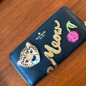 Kate Spade Neda “Run Wild” black leather wallet